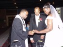 OurWedding 227 * Lamar and Angela both take the Bread of Life. * 600 x 450 * (59KB)
